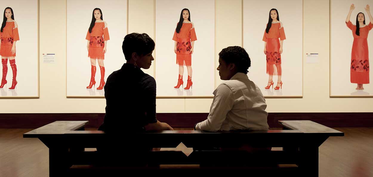 Two members in discussion at an exhibit 