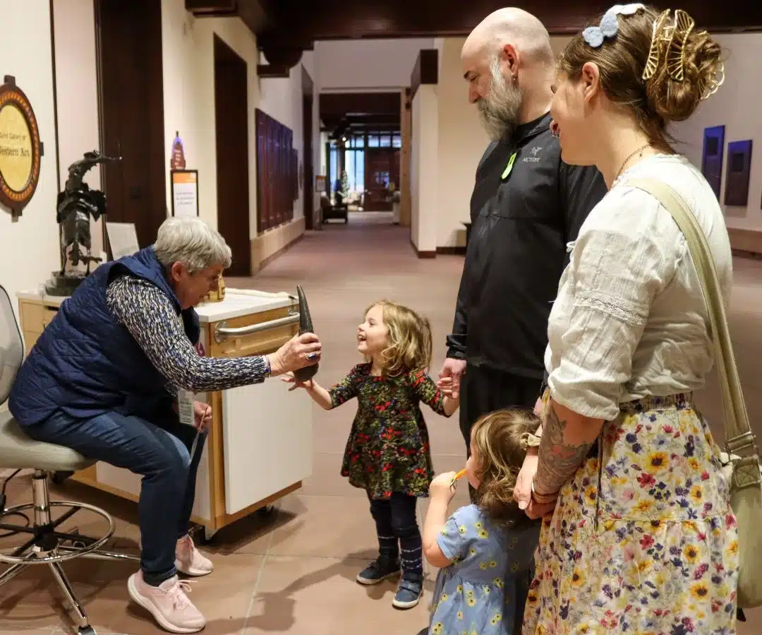 Girl pointing out something during an Eiteljorg Museum Group Tour