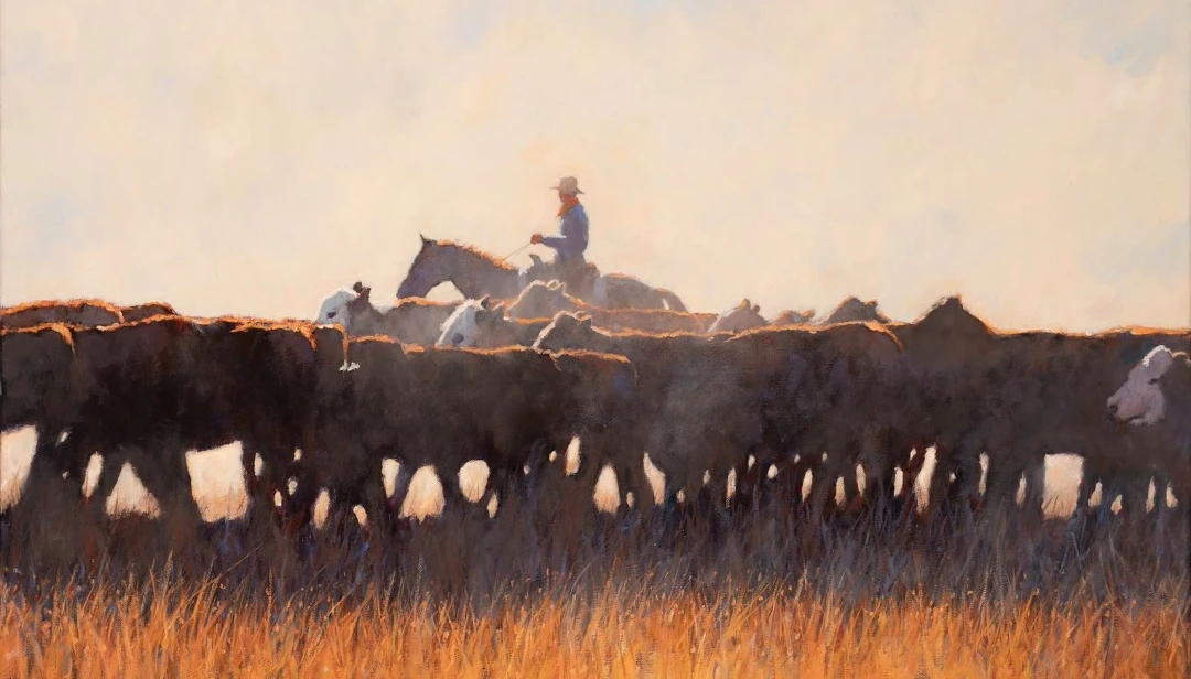 A Cowboy, Cows and Dust